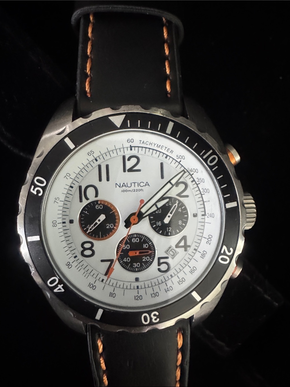 Nautica White Dial Chronograph Watch with Black Bezel and Orange Accents